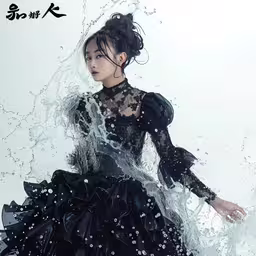 a woman with an over - sized black dress and rain splash,a woman in black dress covered with water