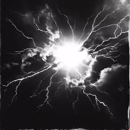 a black and white photo of lightning striking