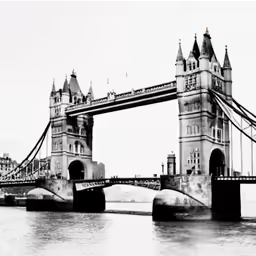an old photo of the tower bridge over water