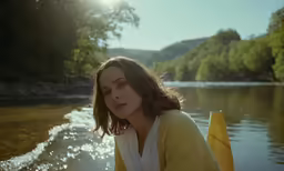 a woman is on the water looking back