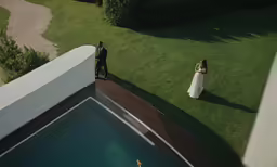a couple is walking away from their wedding ceremony