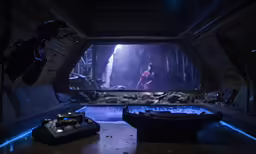 video game equipment in a darkened, abandoned space