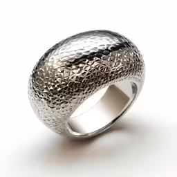 a large ring with a textured finish in silver