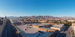 an aerial view of a city in the mountains