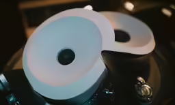 two round toilet paper holders stacked up
