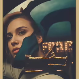 a woman sitting in a car looking out the window at the city lights