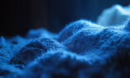 abstract blue art piece with very detailed fabric on it