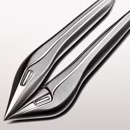 a close up of two scissors with sharp knives