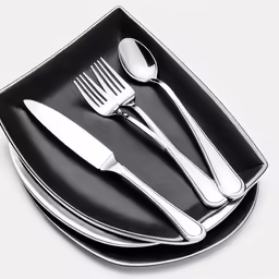 a black plate topped with silverware and fork and knife