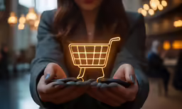 a person holding their hand in a shopping cart shape light