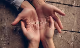 two hands are over the words in a word