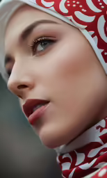 a woman is wearing a red scarf and a white turban
