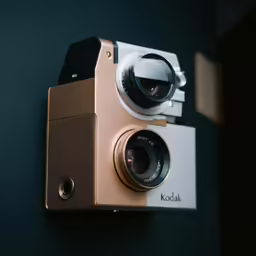 an old video camera hanging from the wall