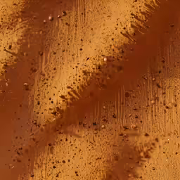 close up of a dirt surface covered in water