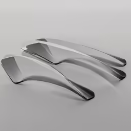 three forks made of metal with curved ends