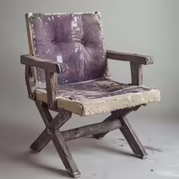 a dirty chair with some kind of purple cloth covering