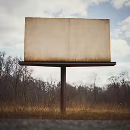 an old book is placed on the side of a road