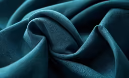 a dark blue background photo for an article on fabric
