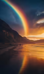 two people walking on a beach under a rainbow