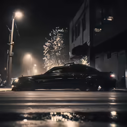 the car is parked in front of an office building at night