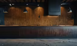 some lights are on in a dimly lit bar