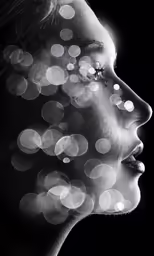 a woman with light in her mouth, in black and white