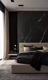 there is a black and white bedroom with a marble wall