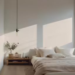 light is shining from the window onto a bed
