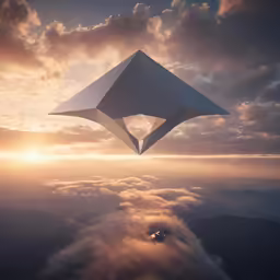 the image of a kite flying in a cloudy sky