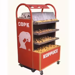 a cart with some pastries and a pair of scissors on it