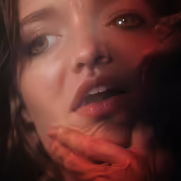 a woman with her hand on her face