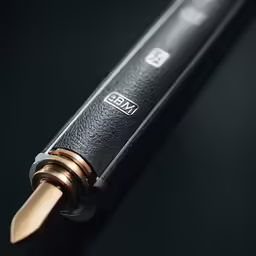 an electronic device with a wooden handle and metal tips