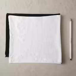 an object with a pencil in it on top of a surface