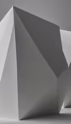 four white 3d shapes arranged in an orderly formation