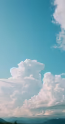 a large body of water sitting under a cloudy sky