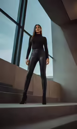 a woman standing on steps wearing high heels