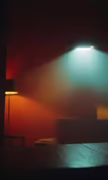 a table with a lamp that is next to it