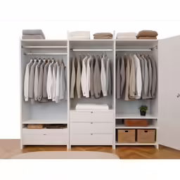 this is a closet with drawers and a clothes hanging on it