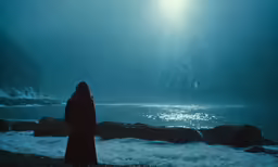 a woman looking out over some water
