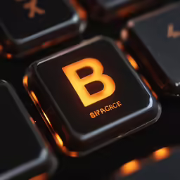 a letter b glowing on a computer keyboard