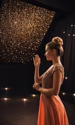 the woman in an evening dress is applauding the stars in the sky