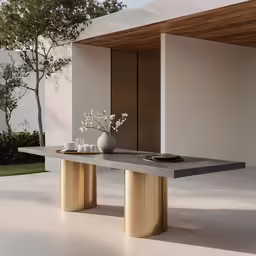 an outdoor room with a table and vases