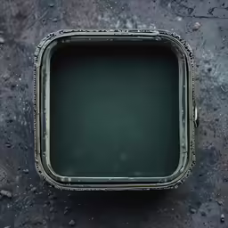an empty metal tray on a black surface