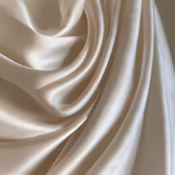 closeup image of a beige colored silk material