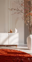 two white vases in the corner of a room