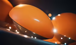 a closeup of some oranges in a bowl