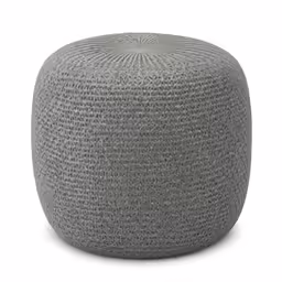 a grey woven ottoman sits in a white background