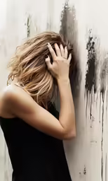a girl with her hair blowing back in her hair,
