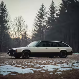 an older station wagon parked in a snow covered field