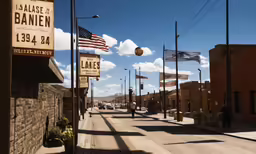 an empty street with old signs and flags